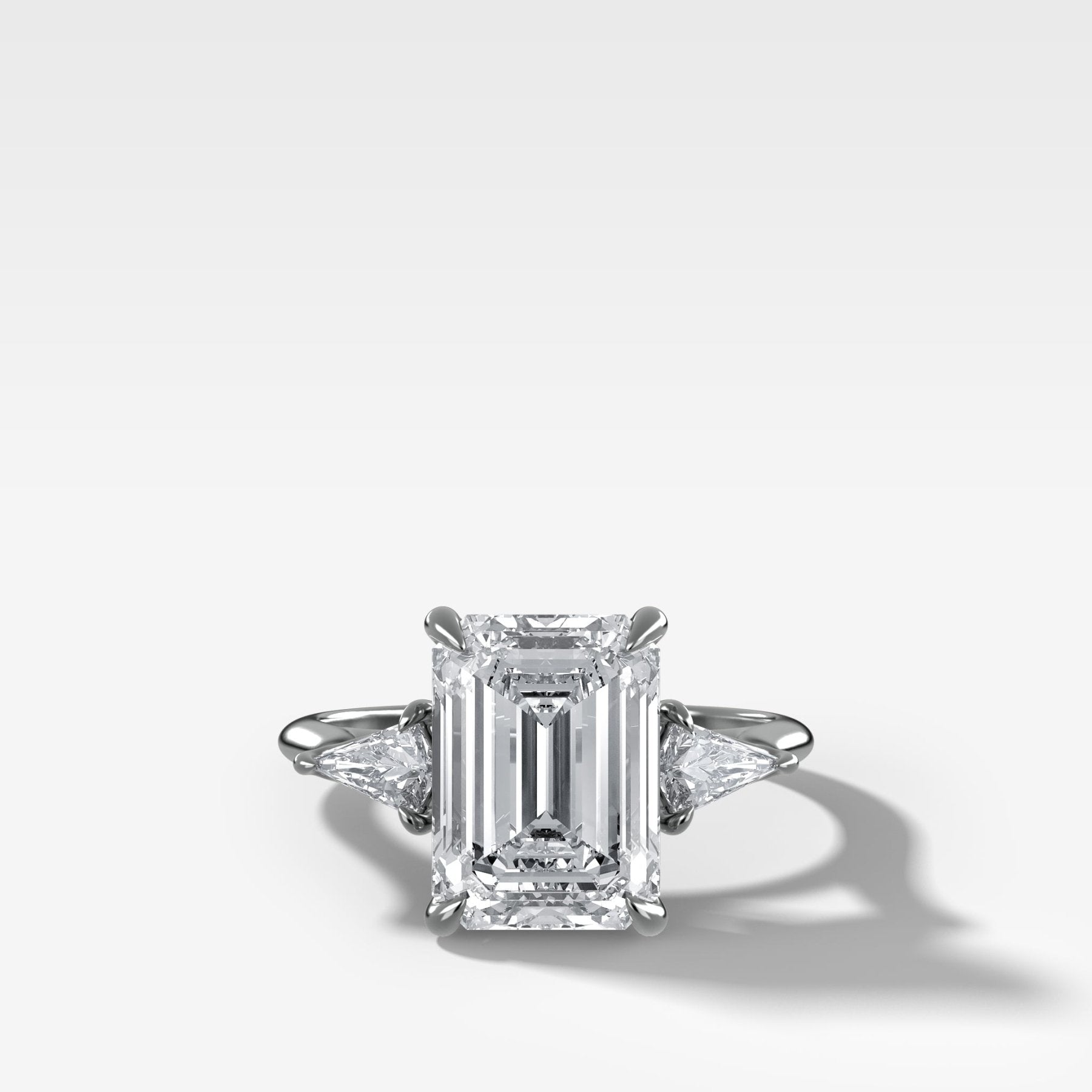 Three Stone Engagement Ring With Kite Side Stones and Emerald Cut Diamond