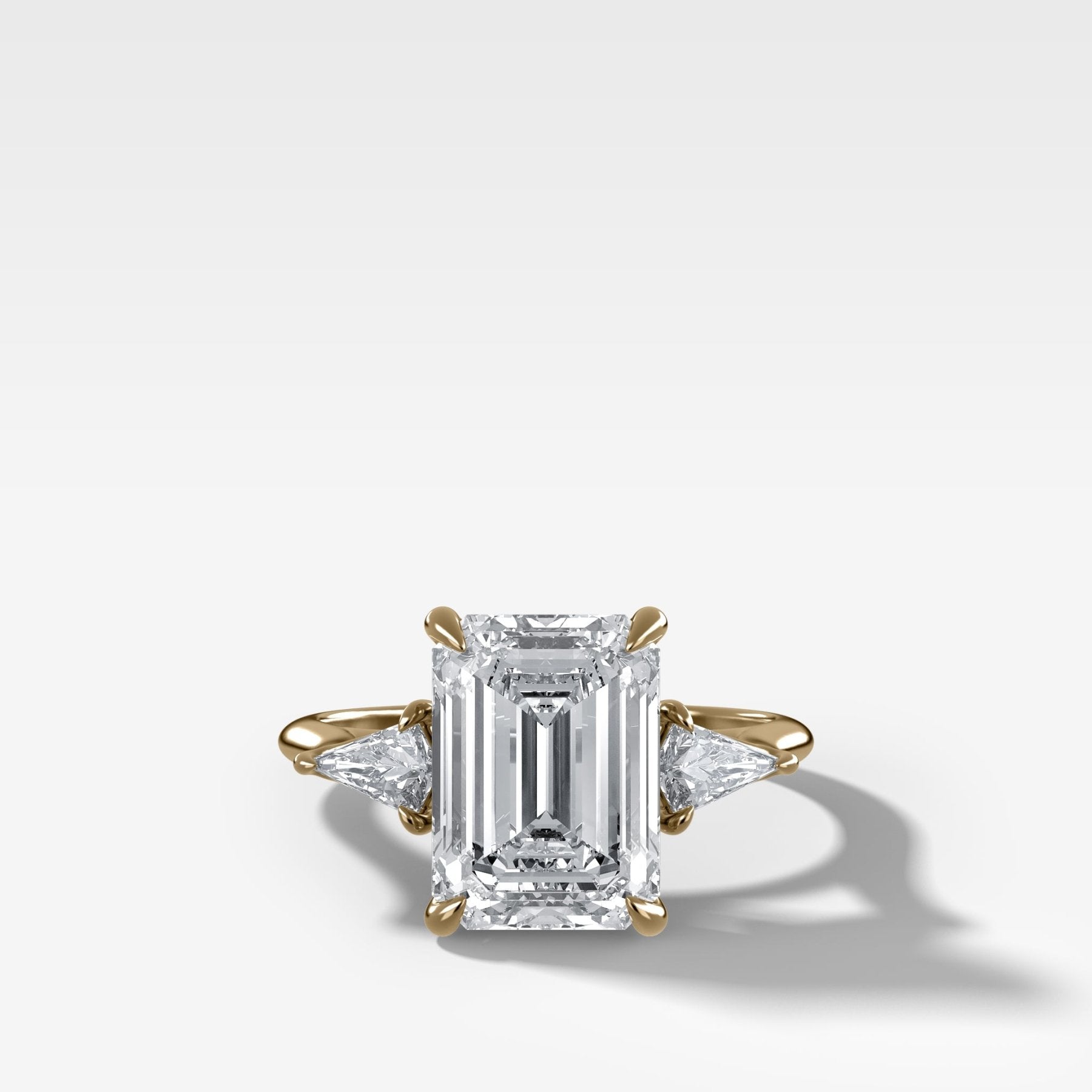 Three Stone Engagement Ring With Kite Side Stones and Emerald Cut Diamond