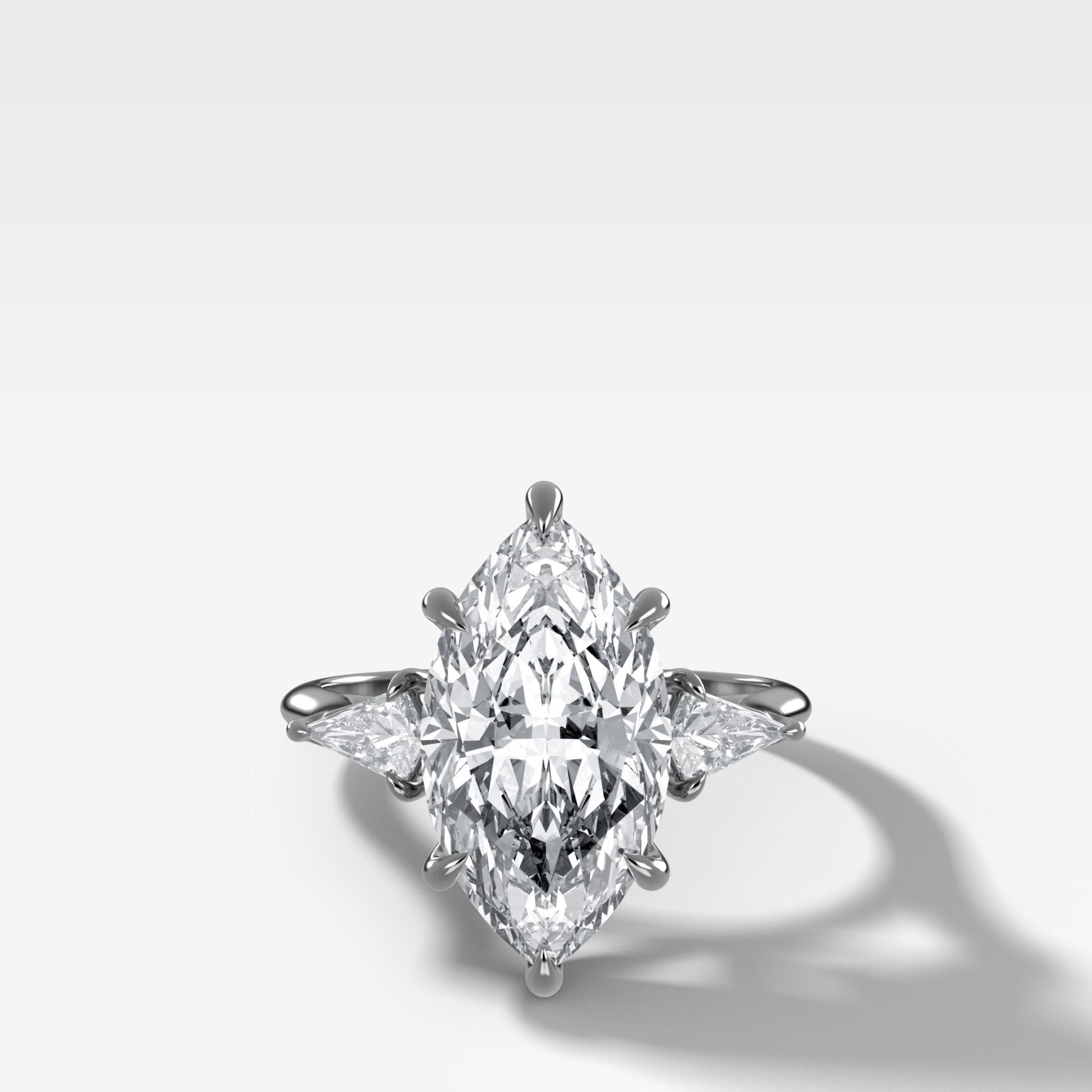 Three Stone Engagement Ring With Kite Side Stones and Marquise Cut Diamond