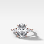 Three Stone Engagement Ring With Kite Side Stones and Oval Cut Diamond