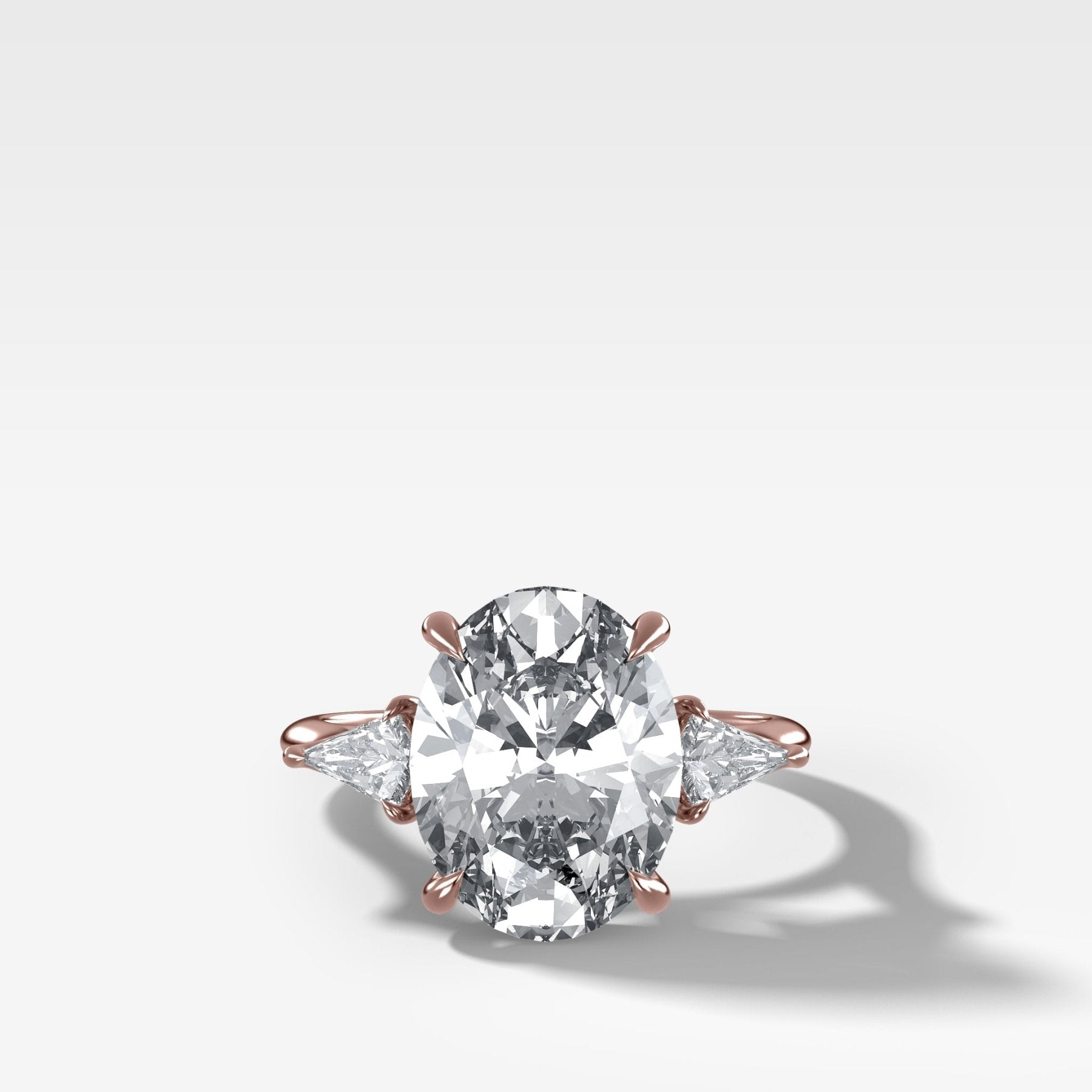 Three Stone Engagement Ring With Kite Side Stones and Oval Cut Diamond