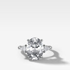 Three Stone Engagement Ring With Kite Side Stones and Oval Cut Diamond