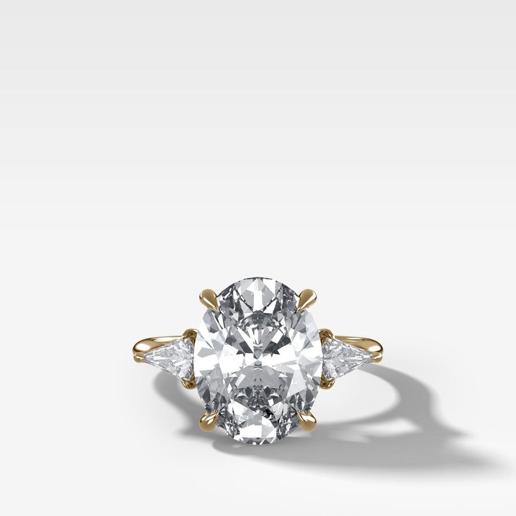 Three Stone Engagement Ring With Kite Side Stones and Oval Cut Diamond