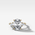 Three Stone Engagement Ring With Kite Side Stones and Oval Cut Diamond