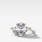 Three Stone Engagement Ring With Kite Side Stones and Oval Cut Diamond