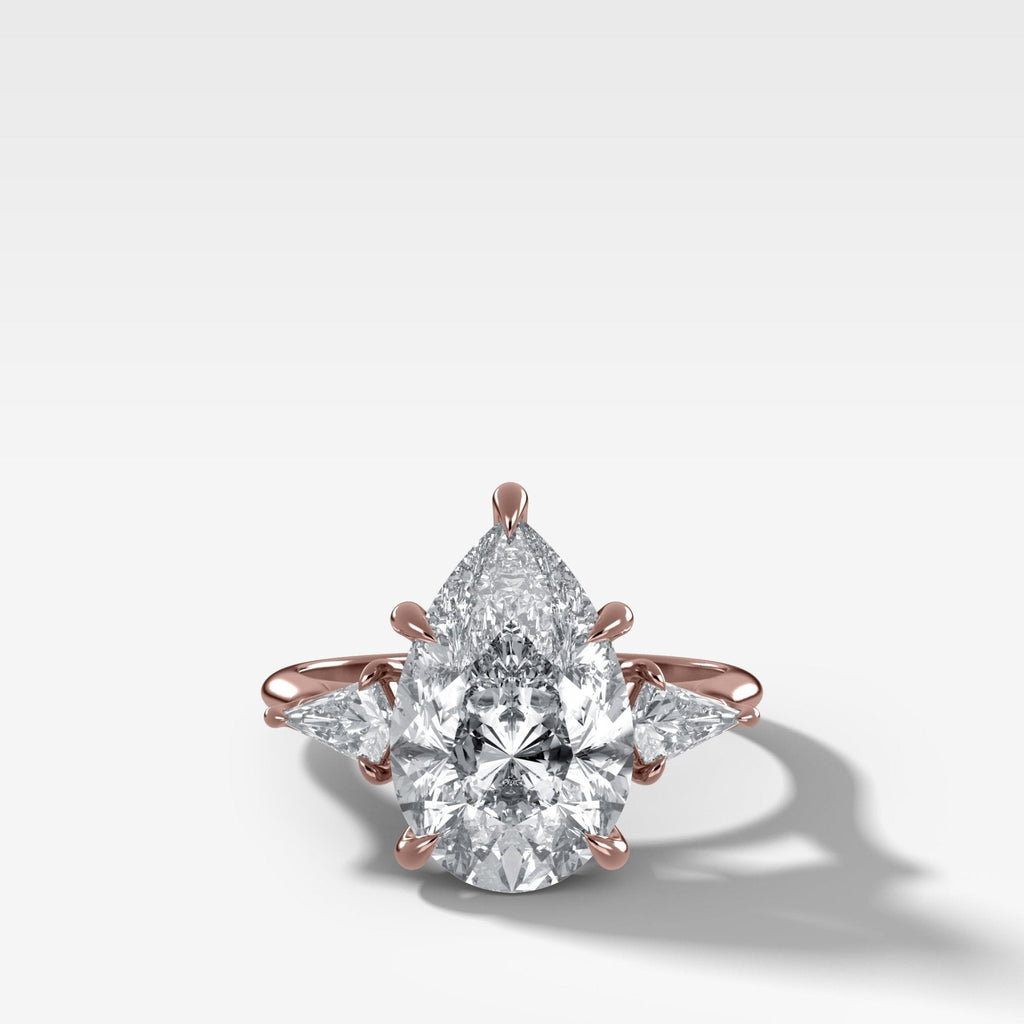 Three Stone Engagement Ring With Kite Side Stones and Pear Cut Diamond