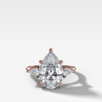 Three Stone Engagement Ring With Kite Side Stones and Pear Cut Diamond