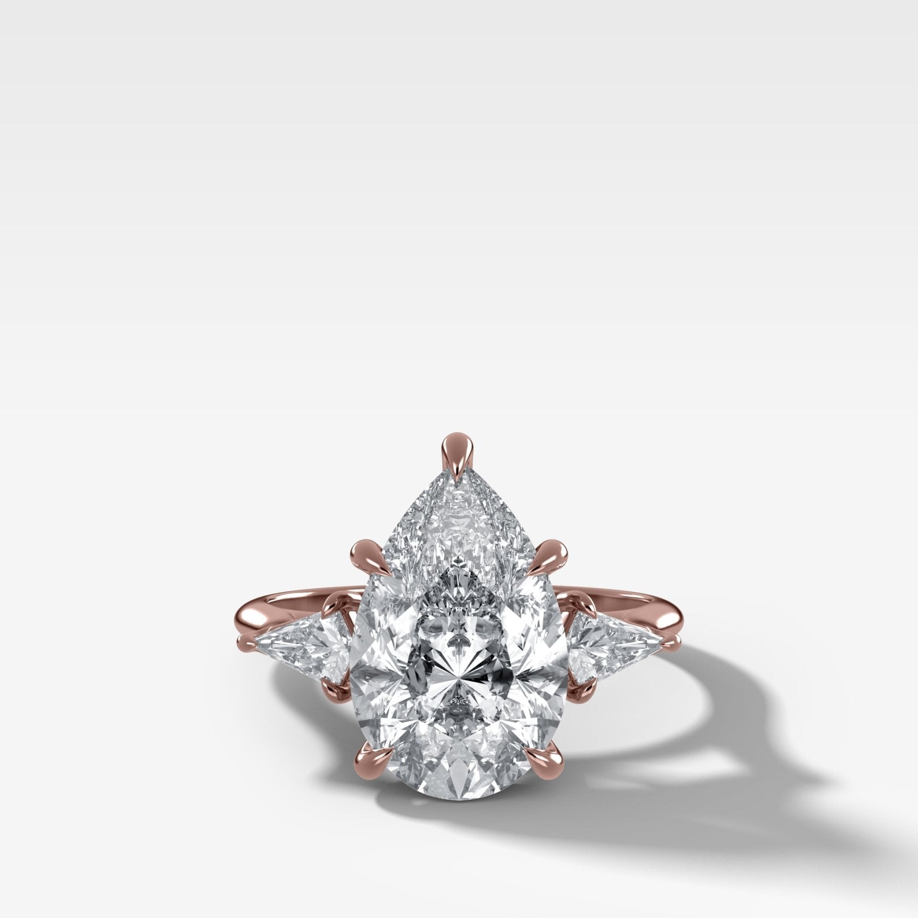 Three Stone Engagement Ring With Kite Side Stones and Pear Cut Diamond