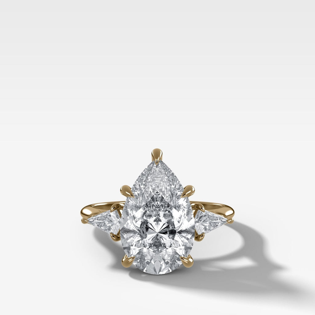 Three Stone Engagement Ring With Kite Side Stones and Pear Cut Diamond