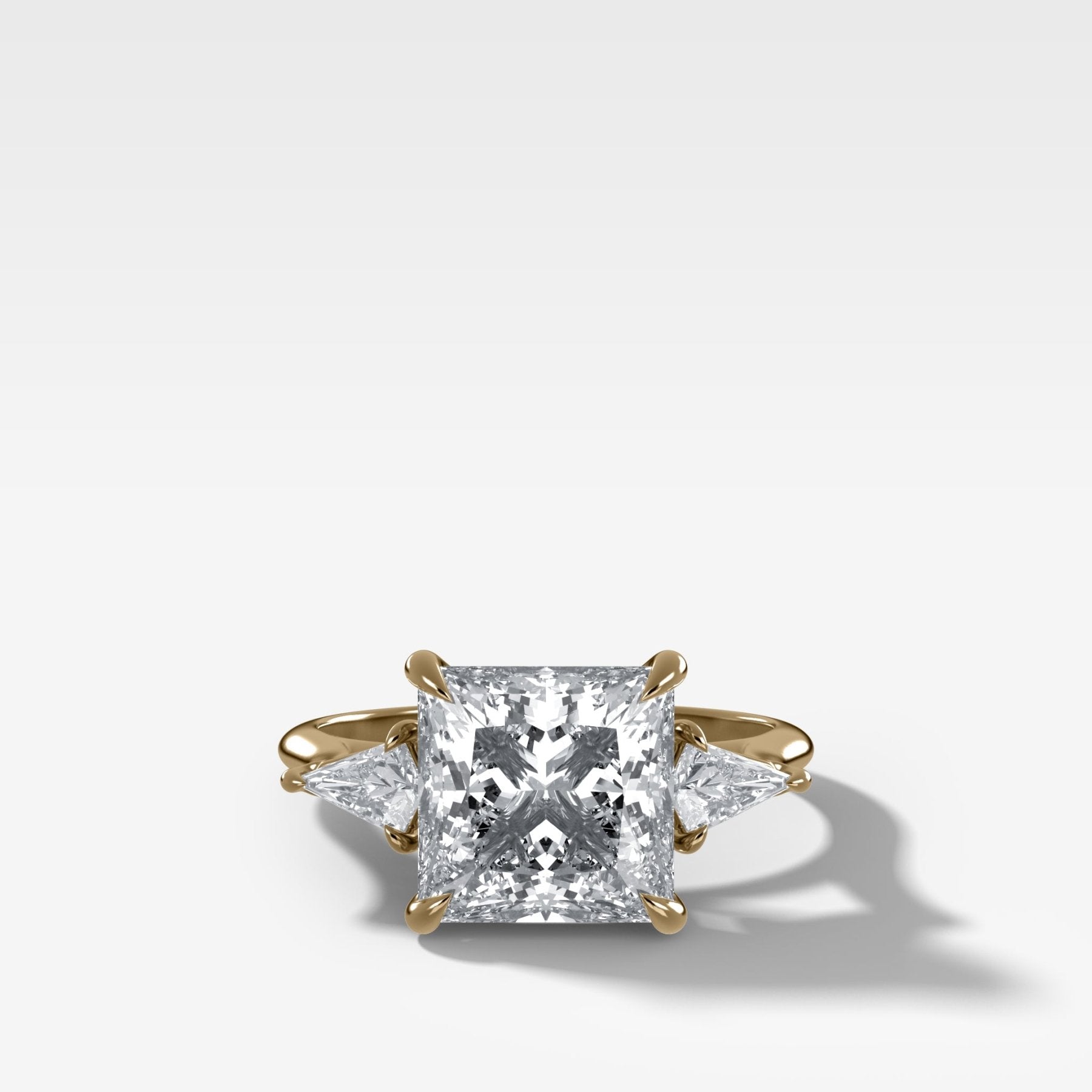 Three Stone Engagement Ring With Kite Side Stones and Princess Cut Diamond