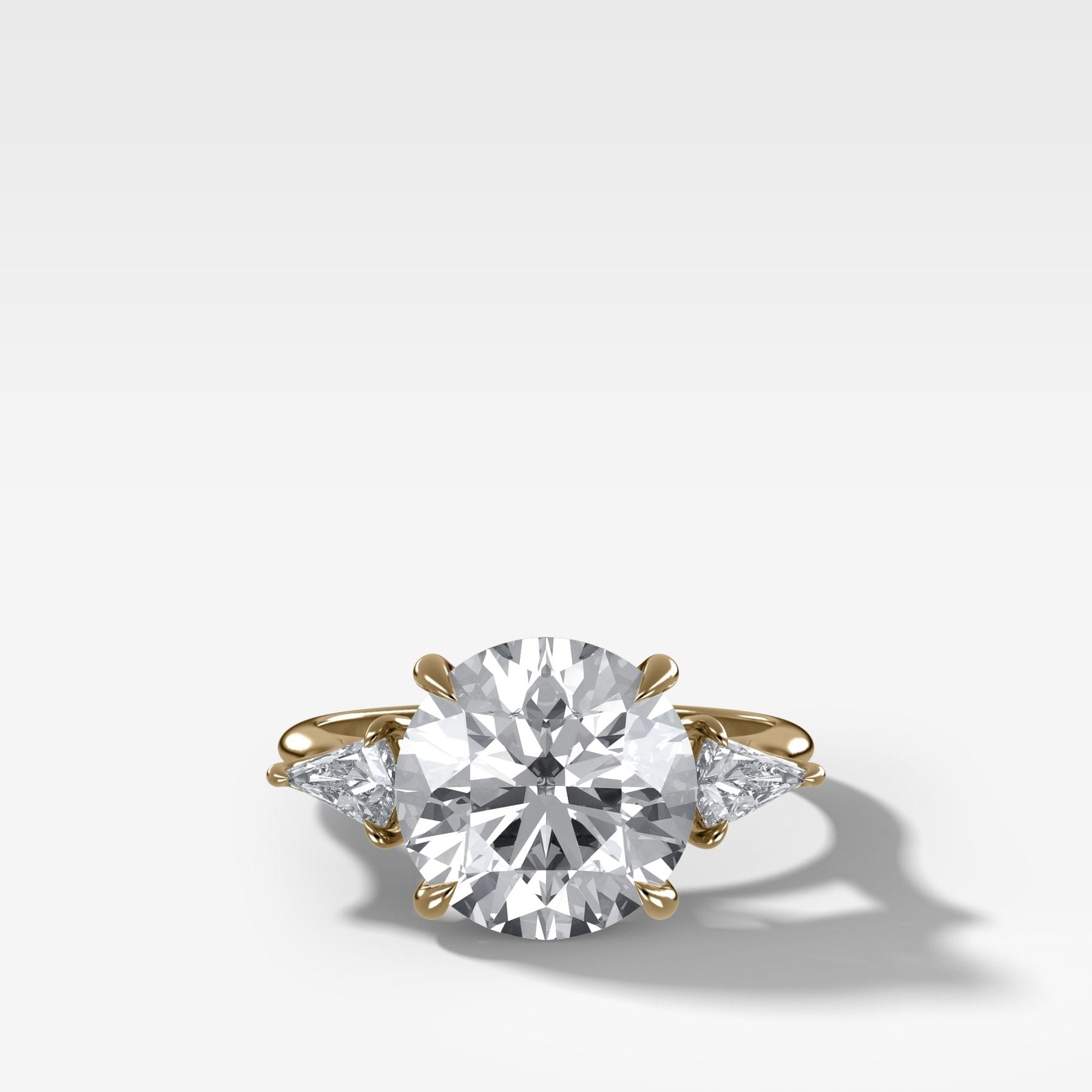 Three Stone Engagement Ring With Kite Side Stones and Round Cut Diamond