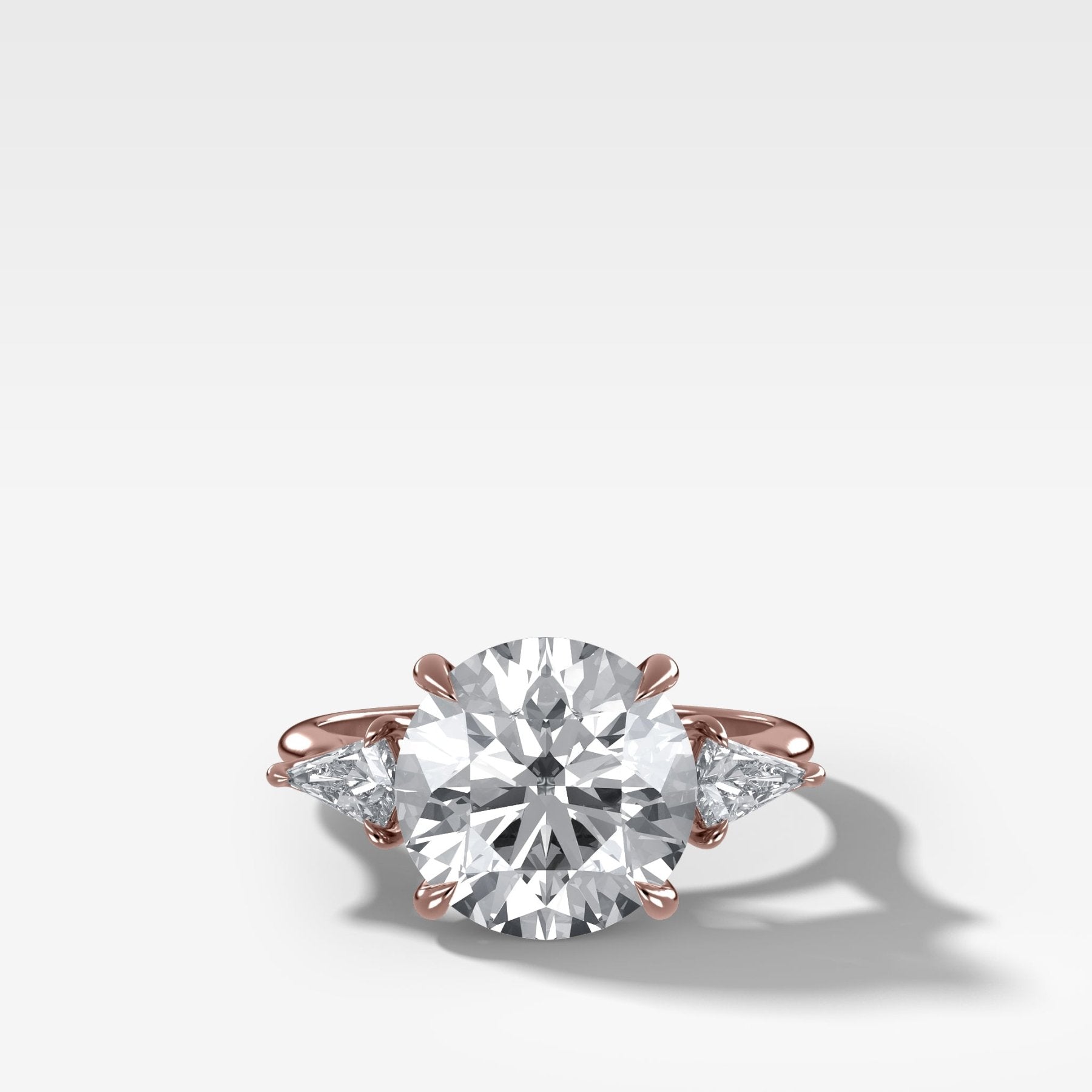Three Stone Engagement Ring With Kite Side Stones and Round Cut Diamond