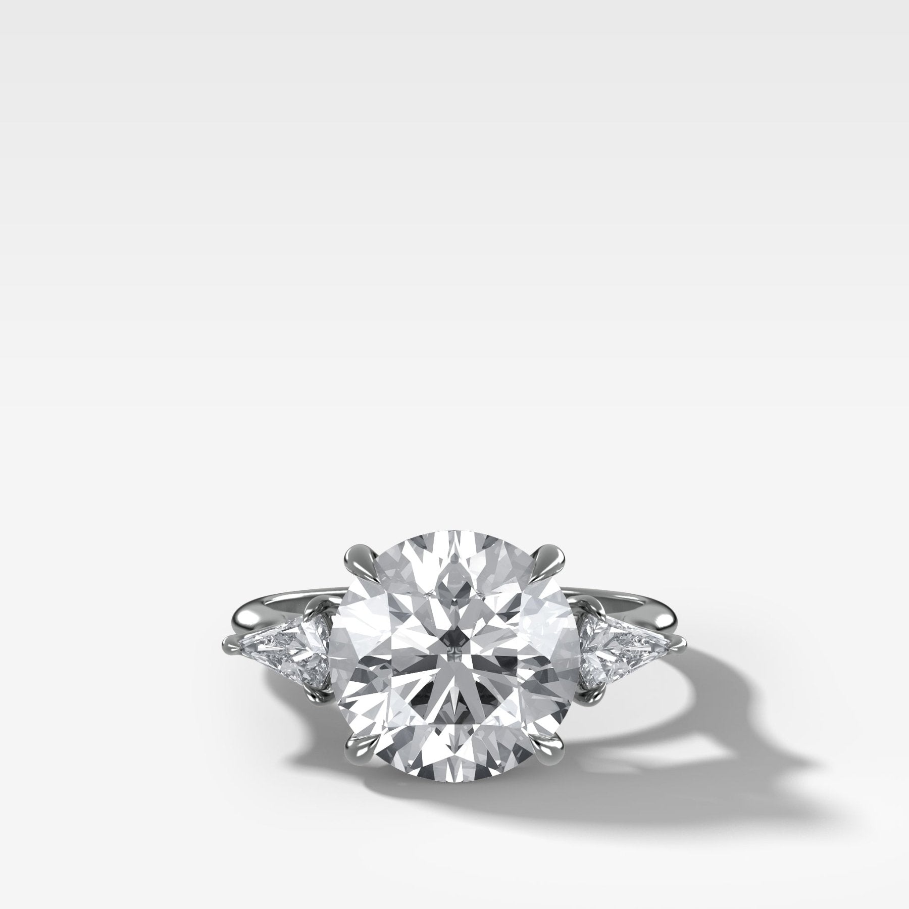 Three Stone Engagement Ring With Kite Side Stones and Round Cut Diamond