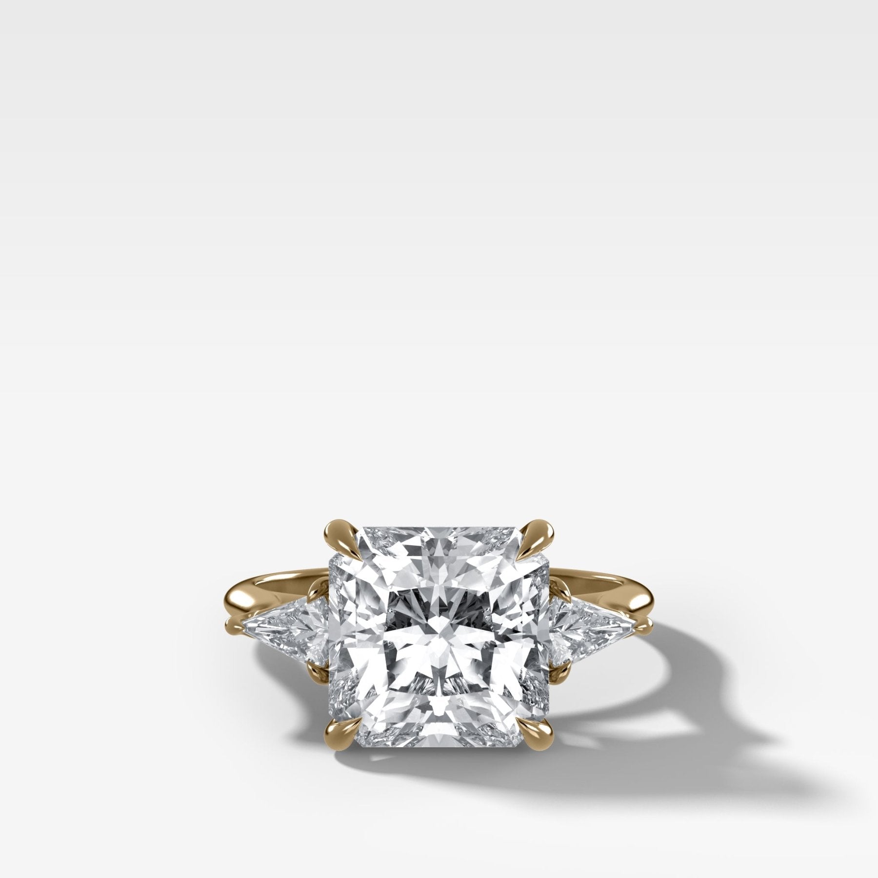 Three Stone Engagement Ring With Kite Side Stones and Square Radiant Cut Diamond