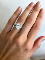 Three Stone Engagement Ring with Shield Side Stones and an Elongated Cushion cut Diamond
