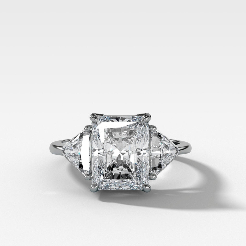 Three Stone Engagement Ring with Shield Side Stones and an Elongated Radiant cut Diamond