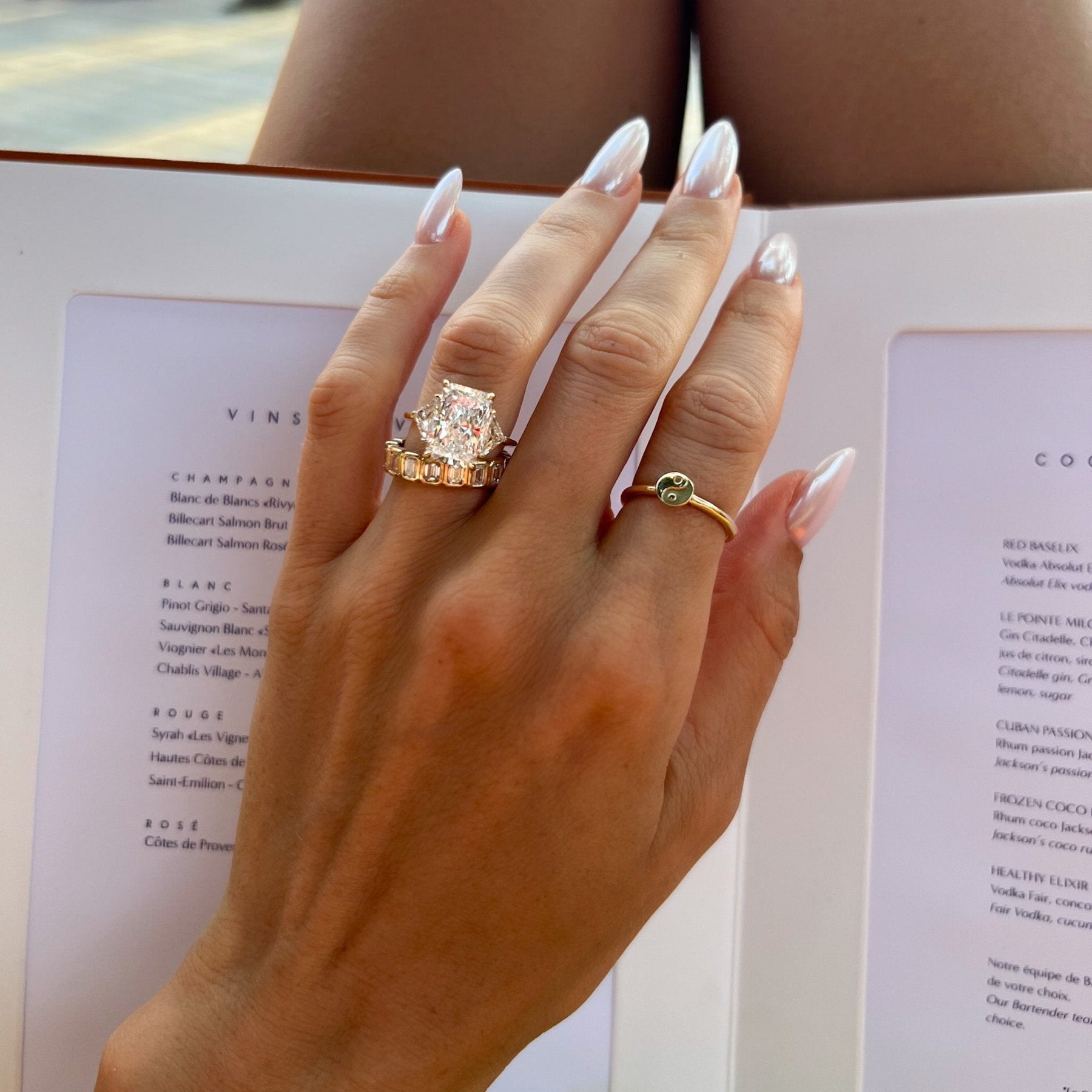 Three Stone Engagement Ring with Shield Side Stones and an Elongated Radiant cut Diamond
