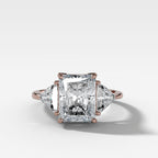 Three Stone Engagement Ring with Shield Side Stones and an Elongated Radiant cut Diamond
