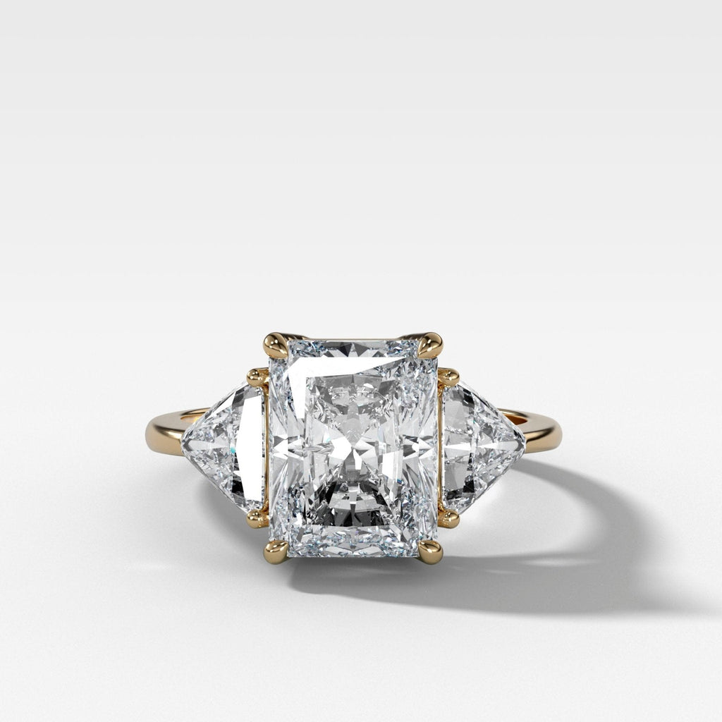 Three Stone Engagement Ring with Shield Side Stones and an Elongated Radiant cut Diamond