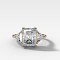 Three Stone Engagement Ring with Shield Side Stones and an Elongated Radiant cut Diamond