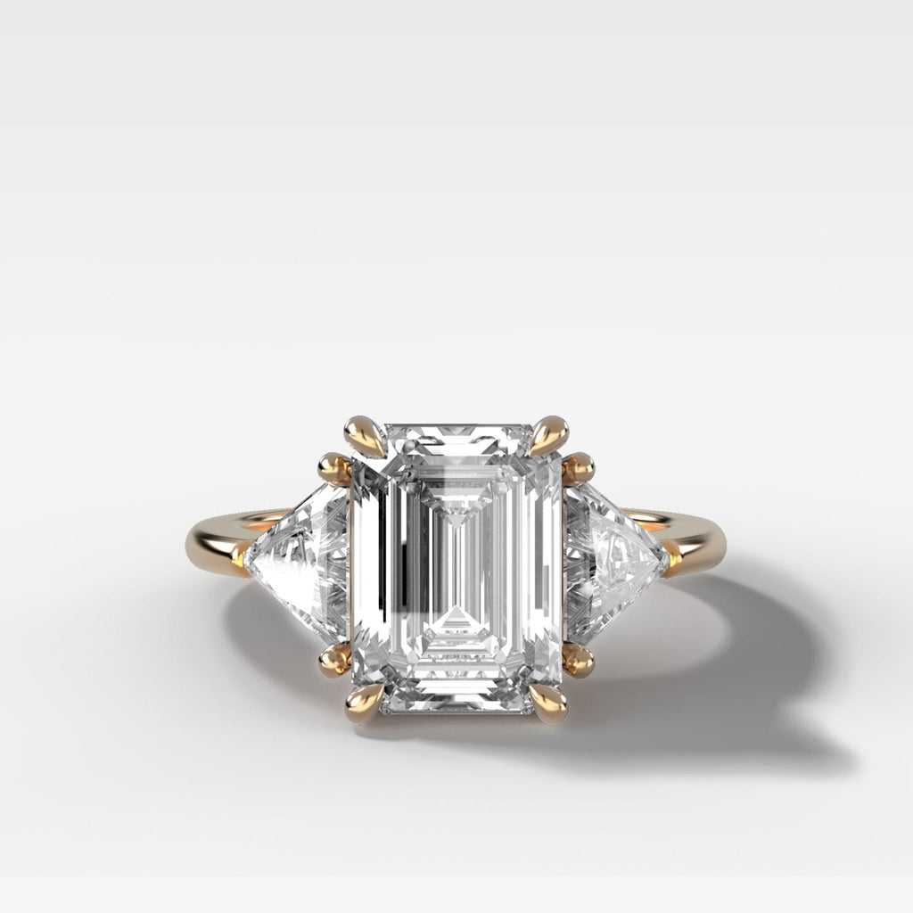 Three Stone Engagement Ring with Shield Side Stones and an Emerald Cut Diamond