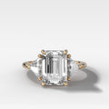 Three Stone Engagement Ring with Shield Side Stones and an Emerald Cut Diamond