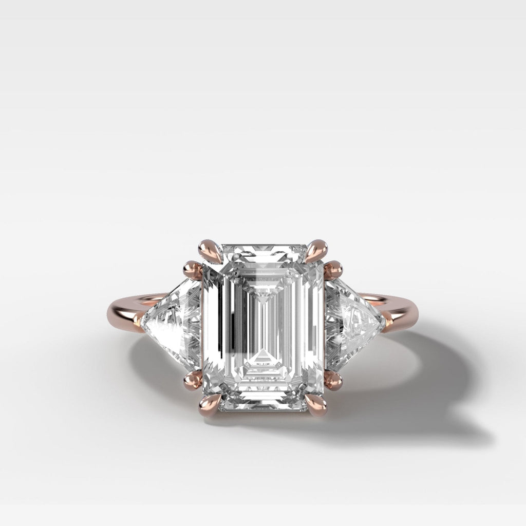Three Stone Engagement Ring with Shield Side Stones and an Emerald Cut Diamond
