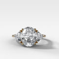 Three Stone Engagement Ring with Shield Side Stones and an Oval cut Diamond