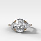 Three Stone Engagement Ring with Shield Side Stones and an Oval cut Diamond