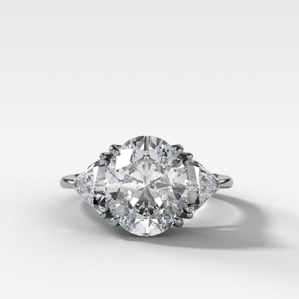 Three Stone Engagement Ring with Shield Side Stones and an Oval cut Diamond