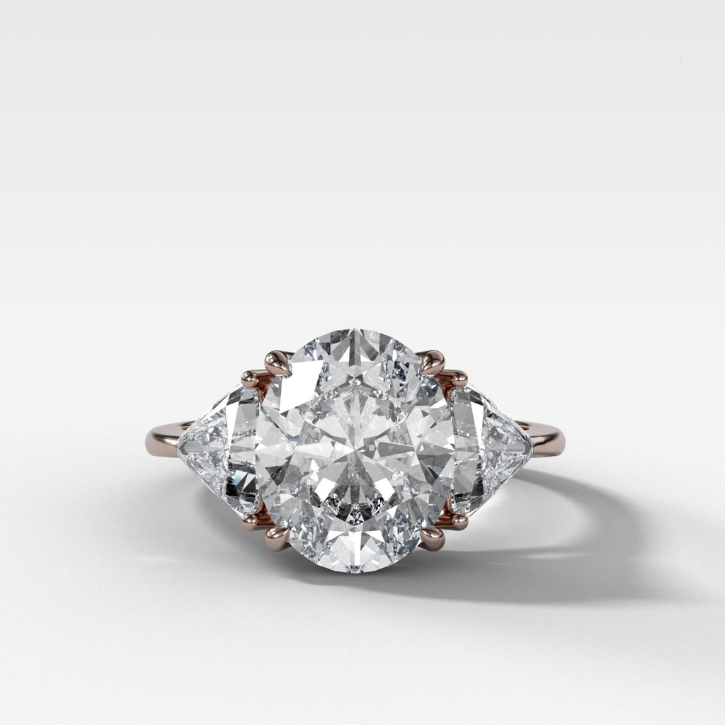 Three Stone Engagement Ring with Shield Side Stones and an Oval cut Diamond