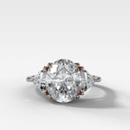 Three Stone Engagement Ring with Shield Side Stones and an Oval cut Diamond