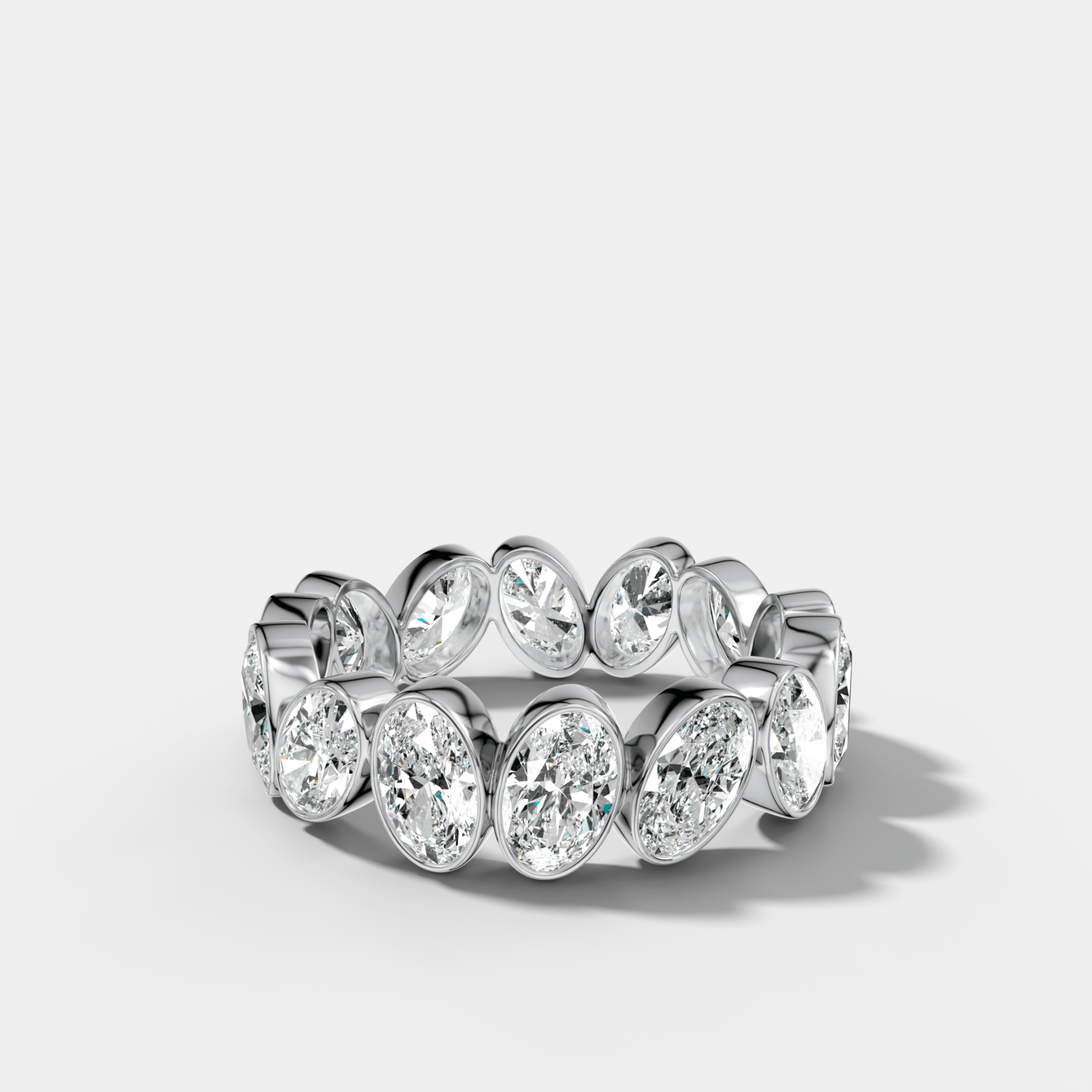 Tilted Bezel Set Eternity Band with Oval Cuts