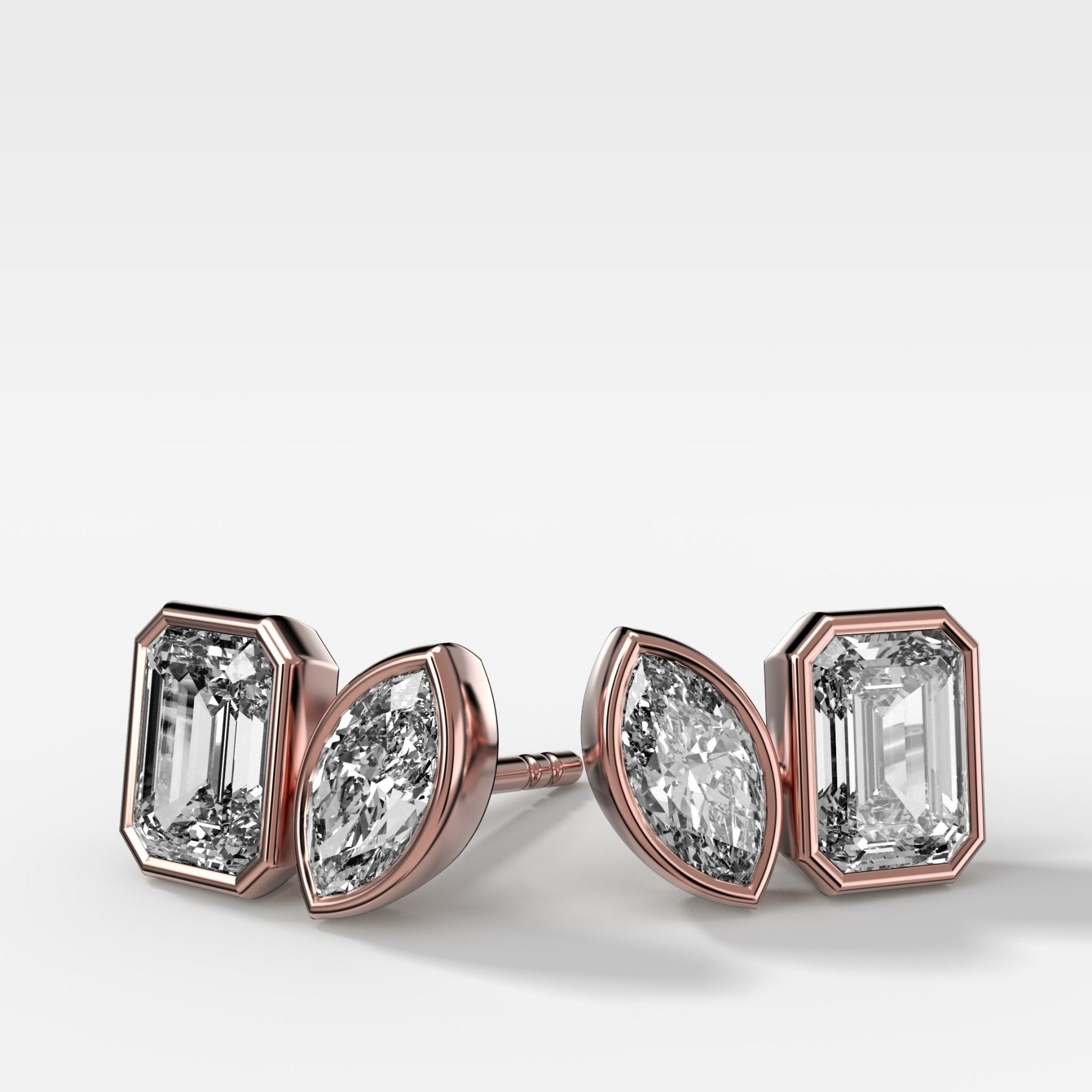 Toi et Moi Bezel Set Diamond Studs with Emerald and Marquise Cuts