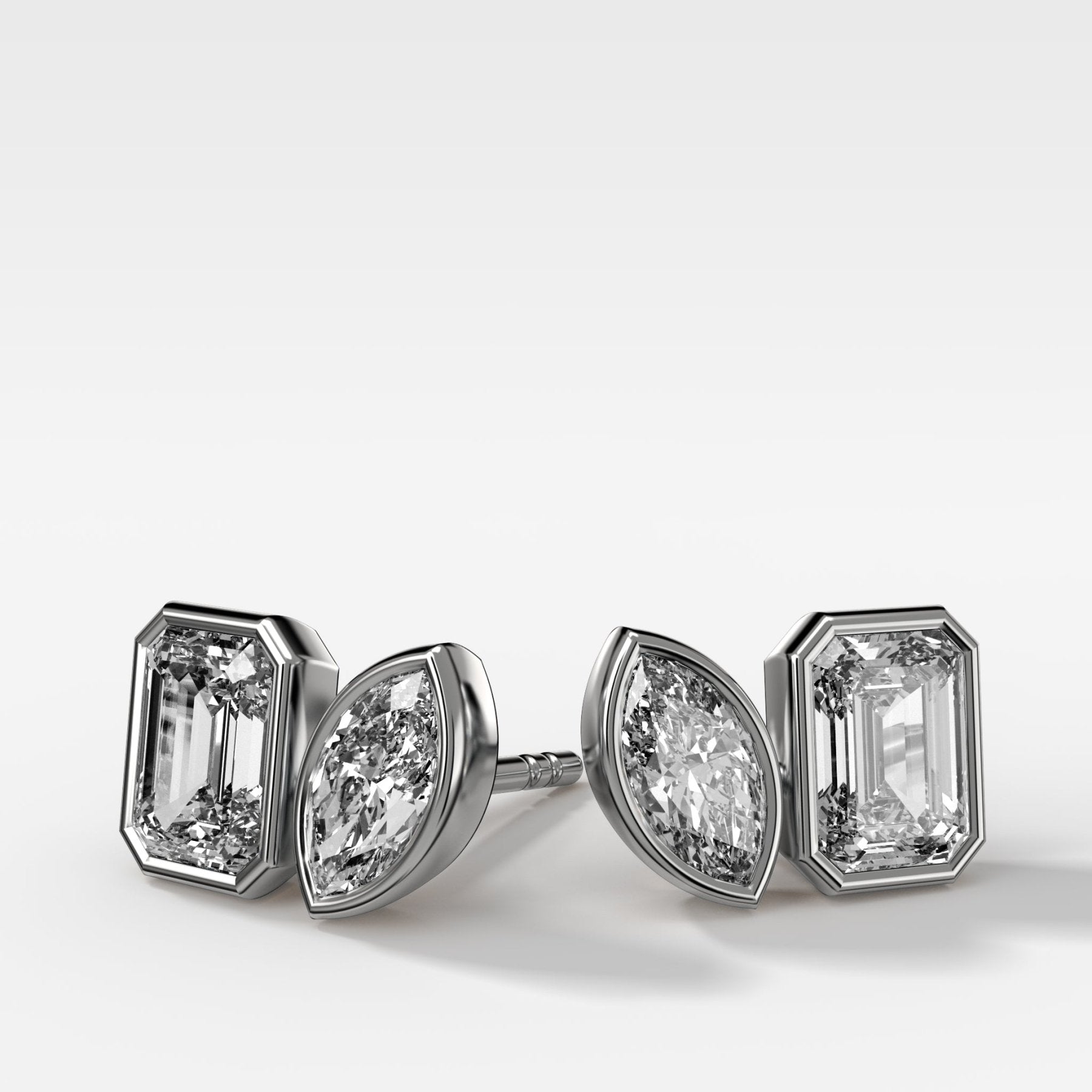 Toi et Moi Bezel Set Diamond Studs with Emerald and Marquise Cuts