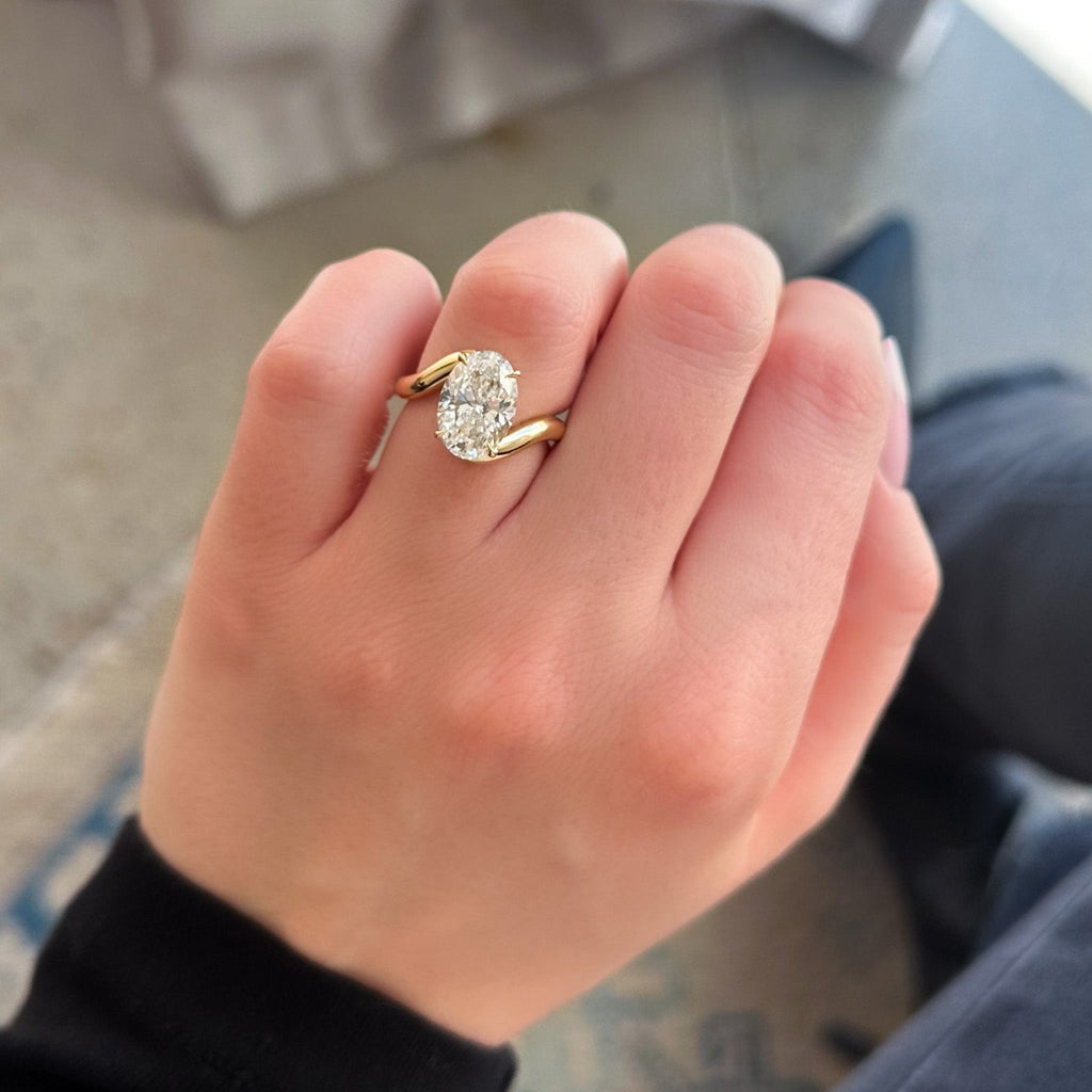 Wave Solitaire Engagement Ring with Oval Cut Diamond