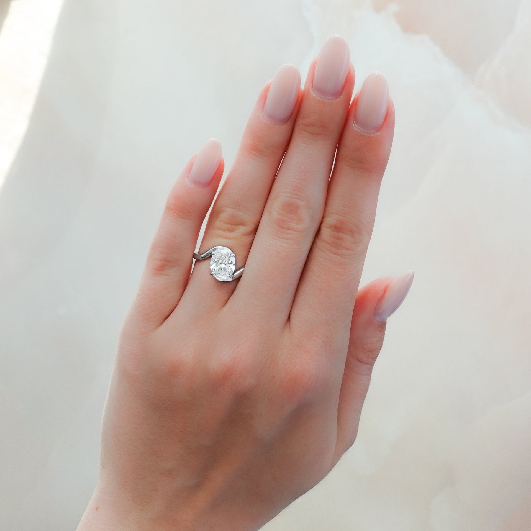 Wave Solitaire Engagement Ring with Oval Cut Diamond